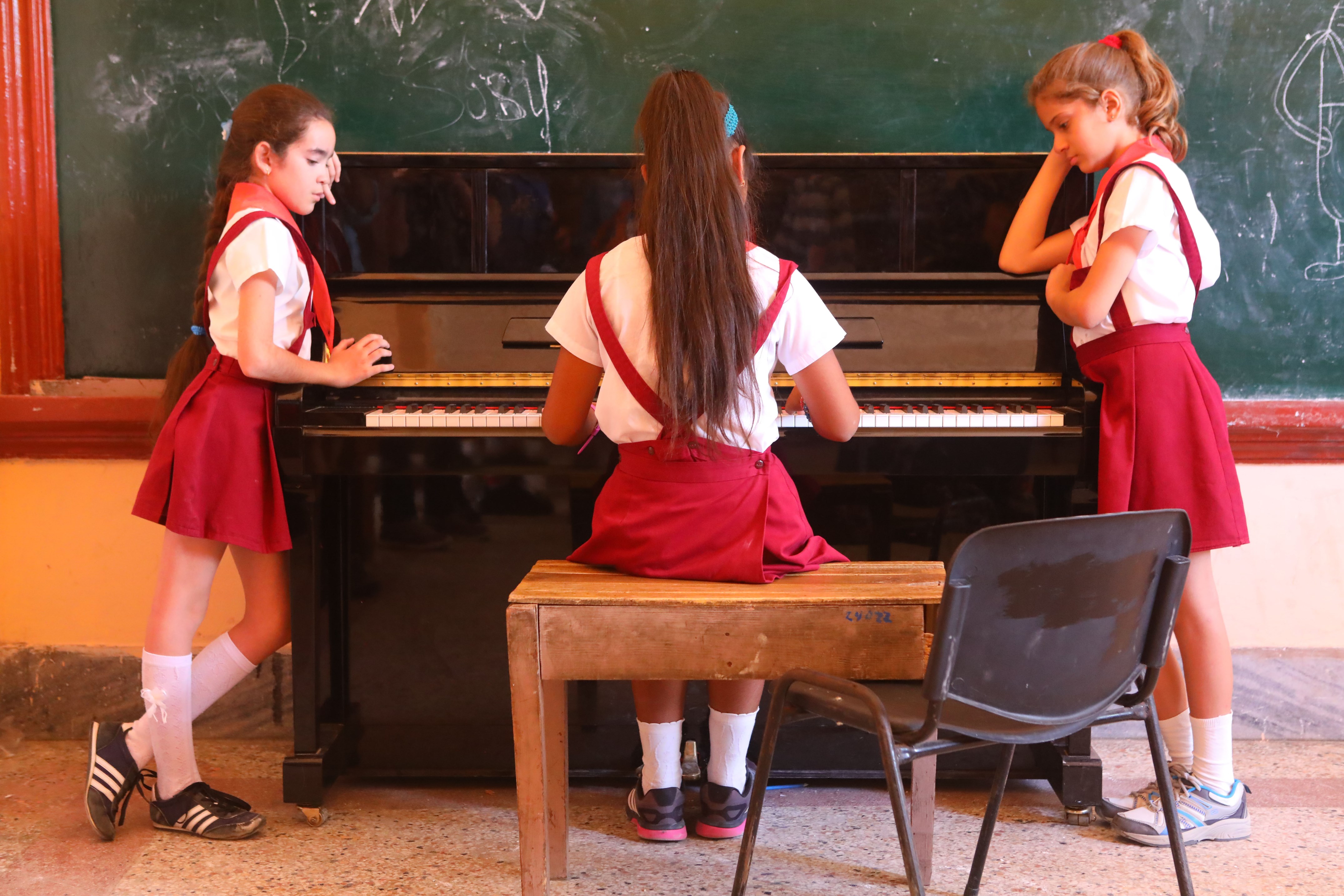 Students practicing piano at the Escuela de Arte Leonardo Luberta Noy, on Isla de la Juventud.