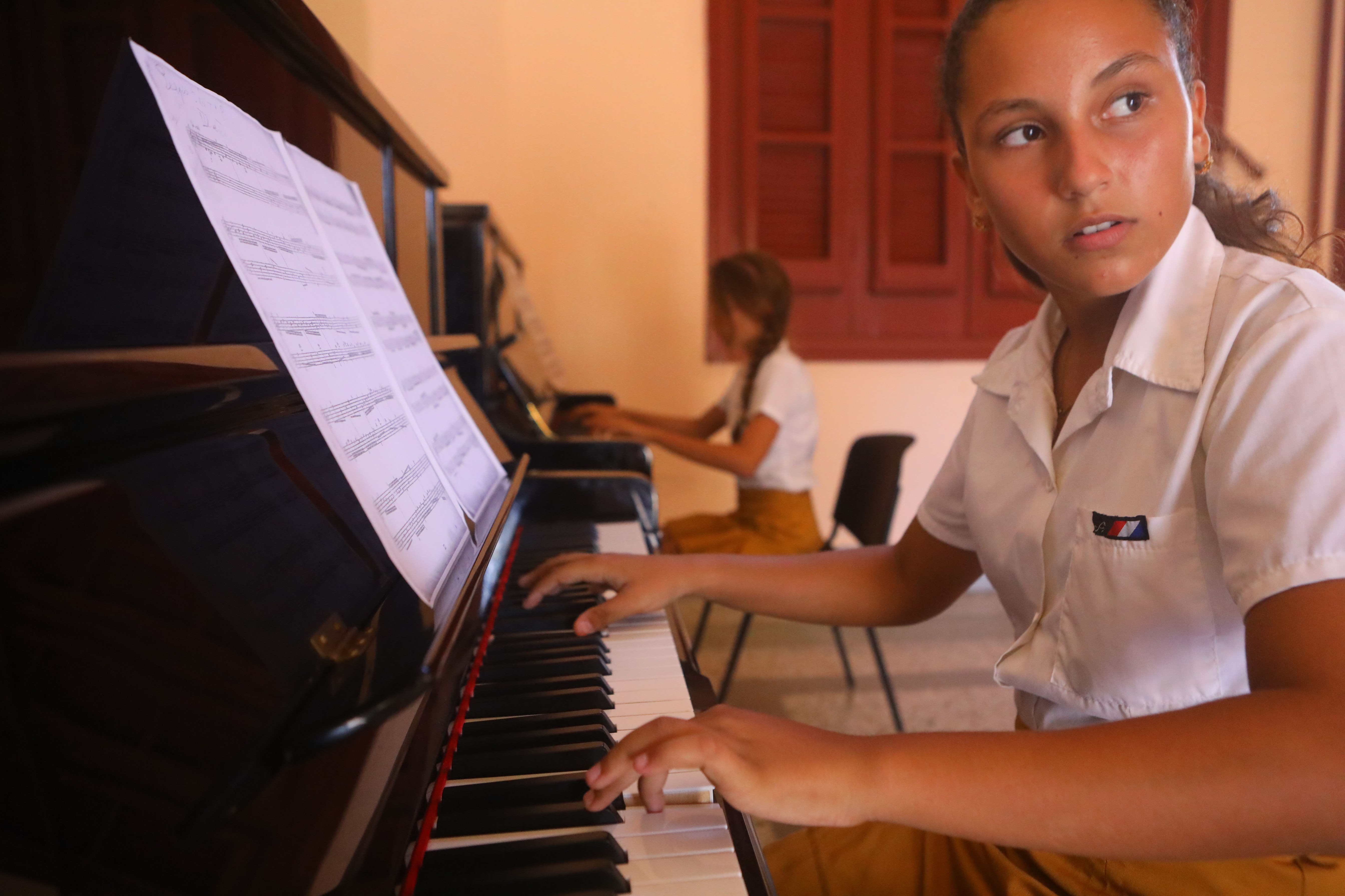 A student practicing piano at the Escuela de Arte Leonardo Luberta Noy, on Isla de la Juventud.